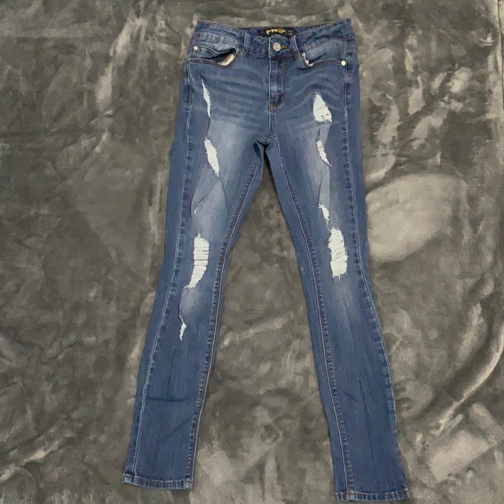 Very distressed jeans size 5. Made with recycled water bottles